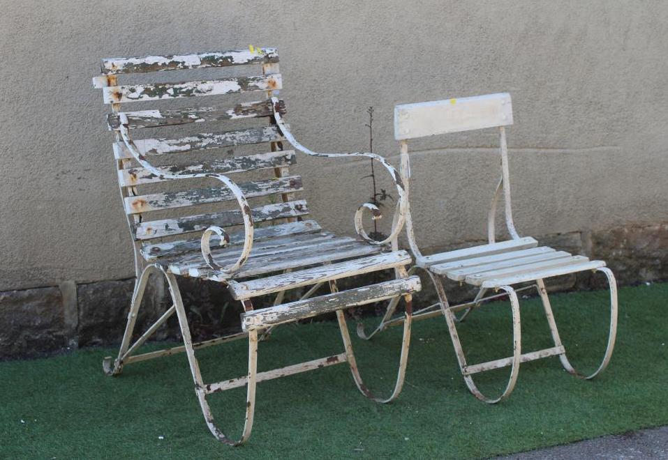 A VICTORIAN IRON STRAPWORK ARMCHAIR with slatted wood seat and back and scrolled arms and legs Image