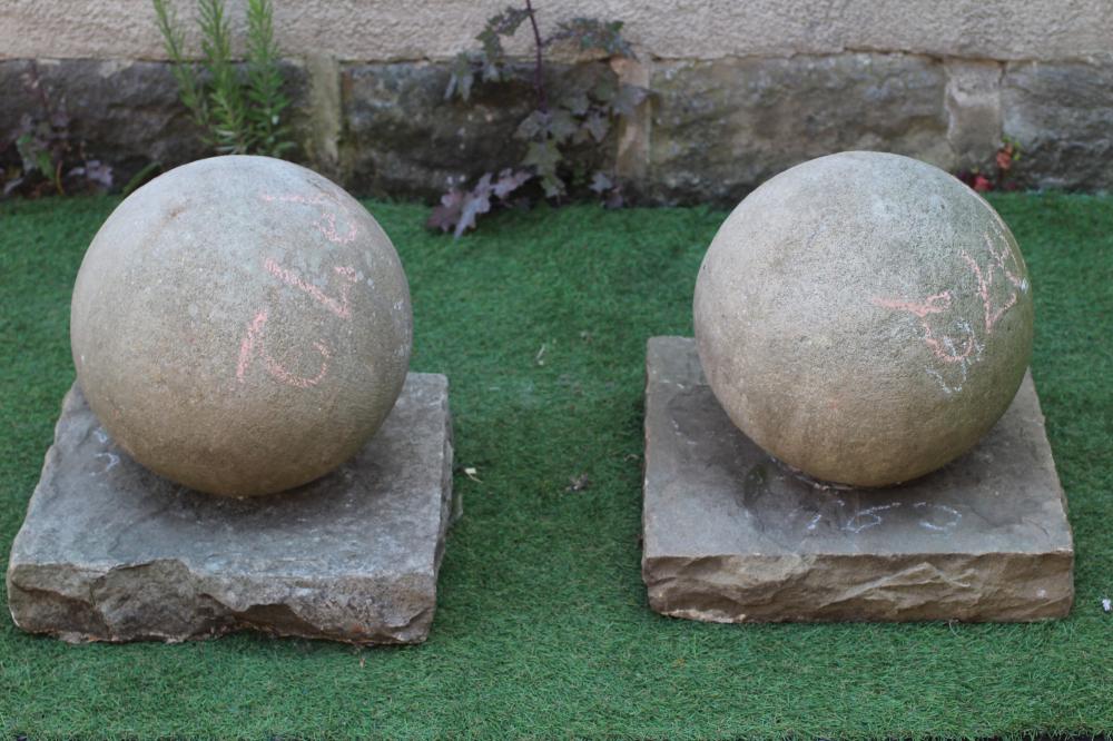 A PAIR OF SANDSTONE BALL FINIALS on square base, 16" w x 17 1/2" h (Est. plus 24% premium inc. VAT) Image
