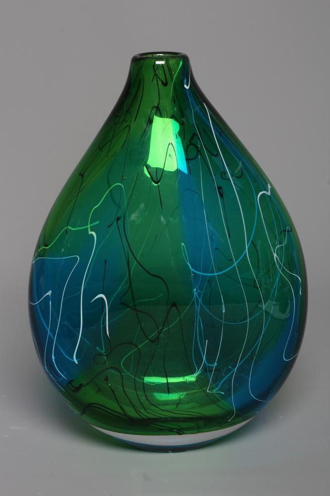 A STUART AKROYD GREEN LUDIC GLASS VASE of flattened oval form, signed, labelled, 9 1/2" high (Est. Image