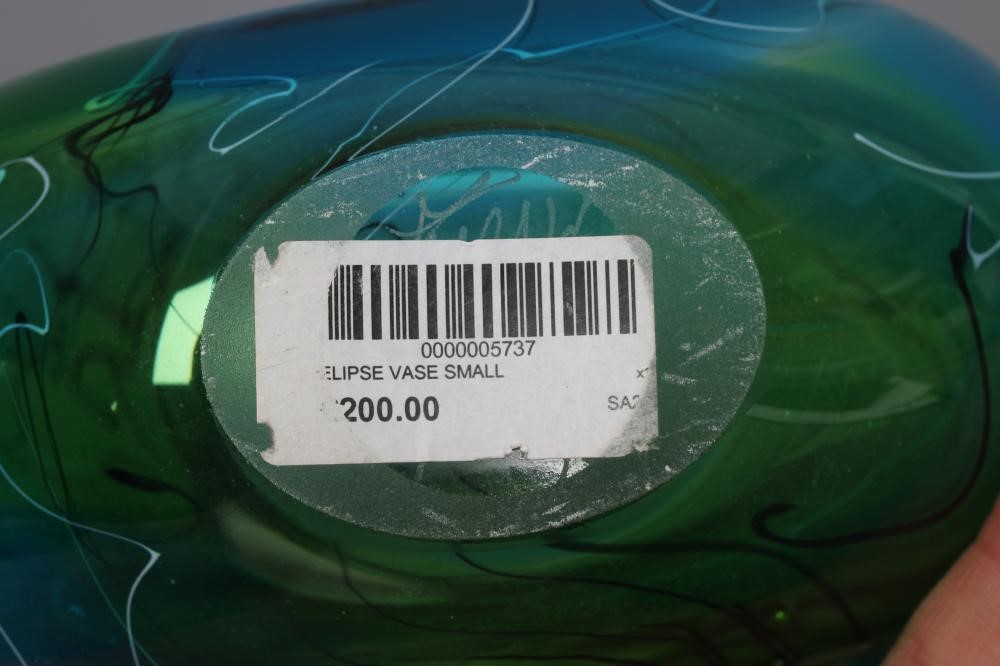 A STUART AKROYD GREEN LUDIC GLASS VASE of flattened oval form, signed, labelled, 9 1/2" high (Est. Image