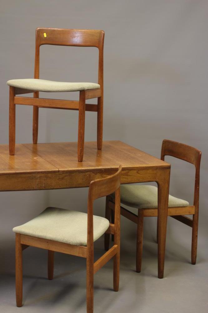 A RETRO TEAK DINING TABLE AND FOUR CHAIRS Image