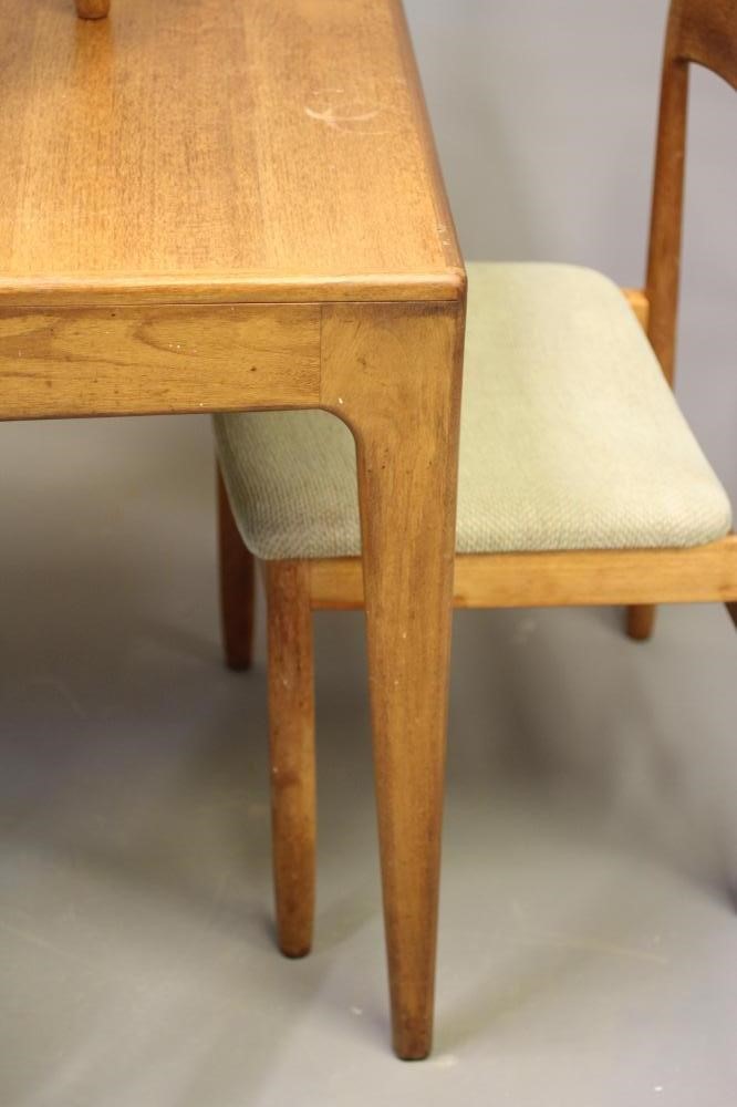 A RETRO TEAK DINING TABLE AND FOUR CHAIRS Image