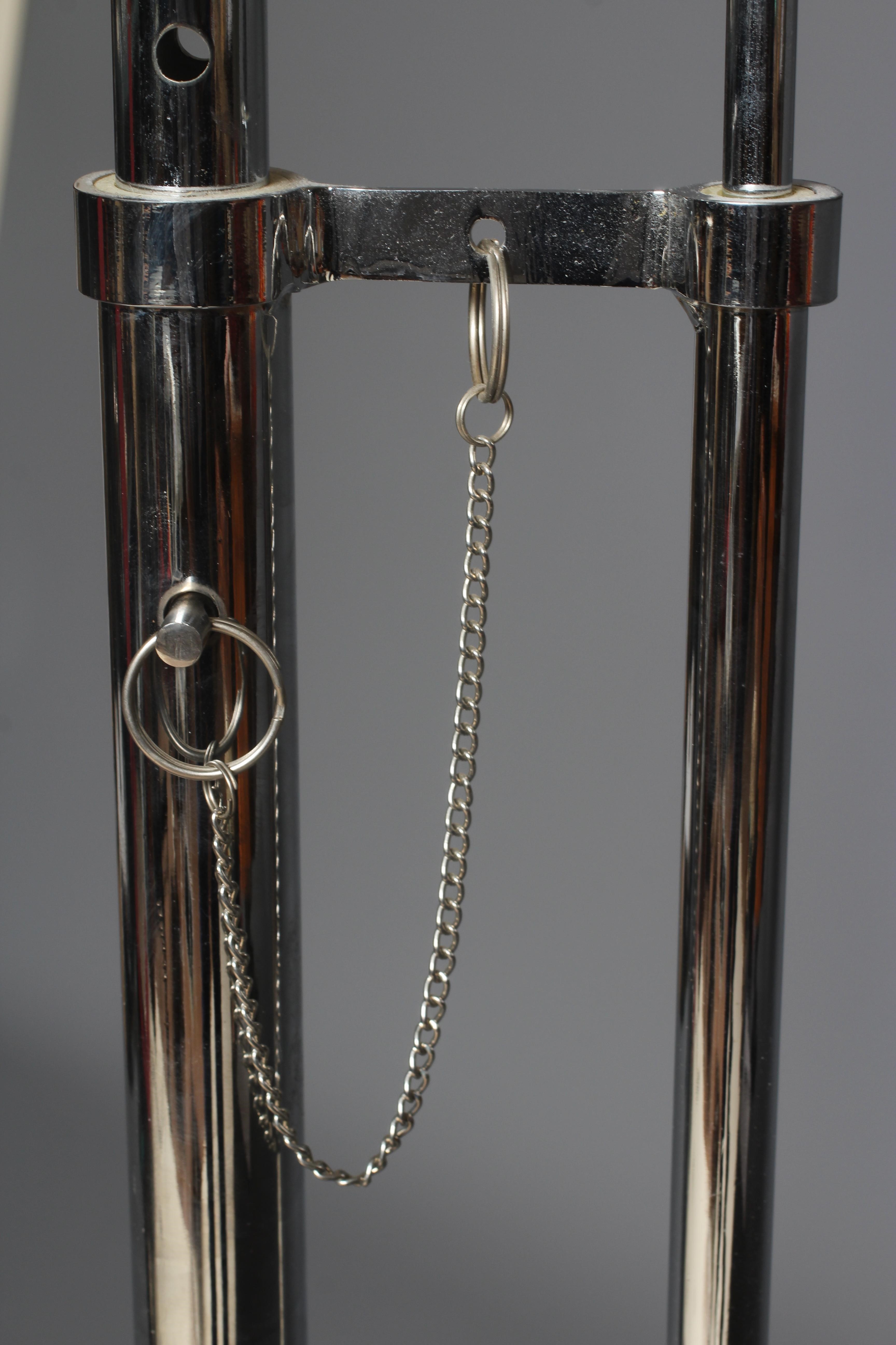 AFTER EILEEN GRAY - AN ADJUSTABLE E1027 SIDE TABLE, modern, the chromed steel frame supporting a Image