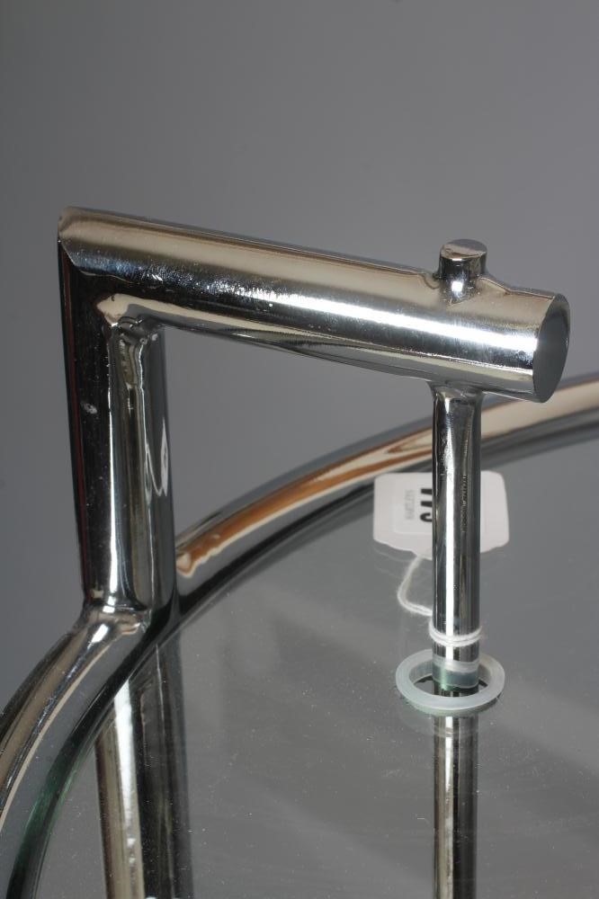 AFTER EILEEN GRAY - AN ADJUSTABLE E1027 SIDE TABLE, modern, the chromed steel frame supporting a Image