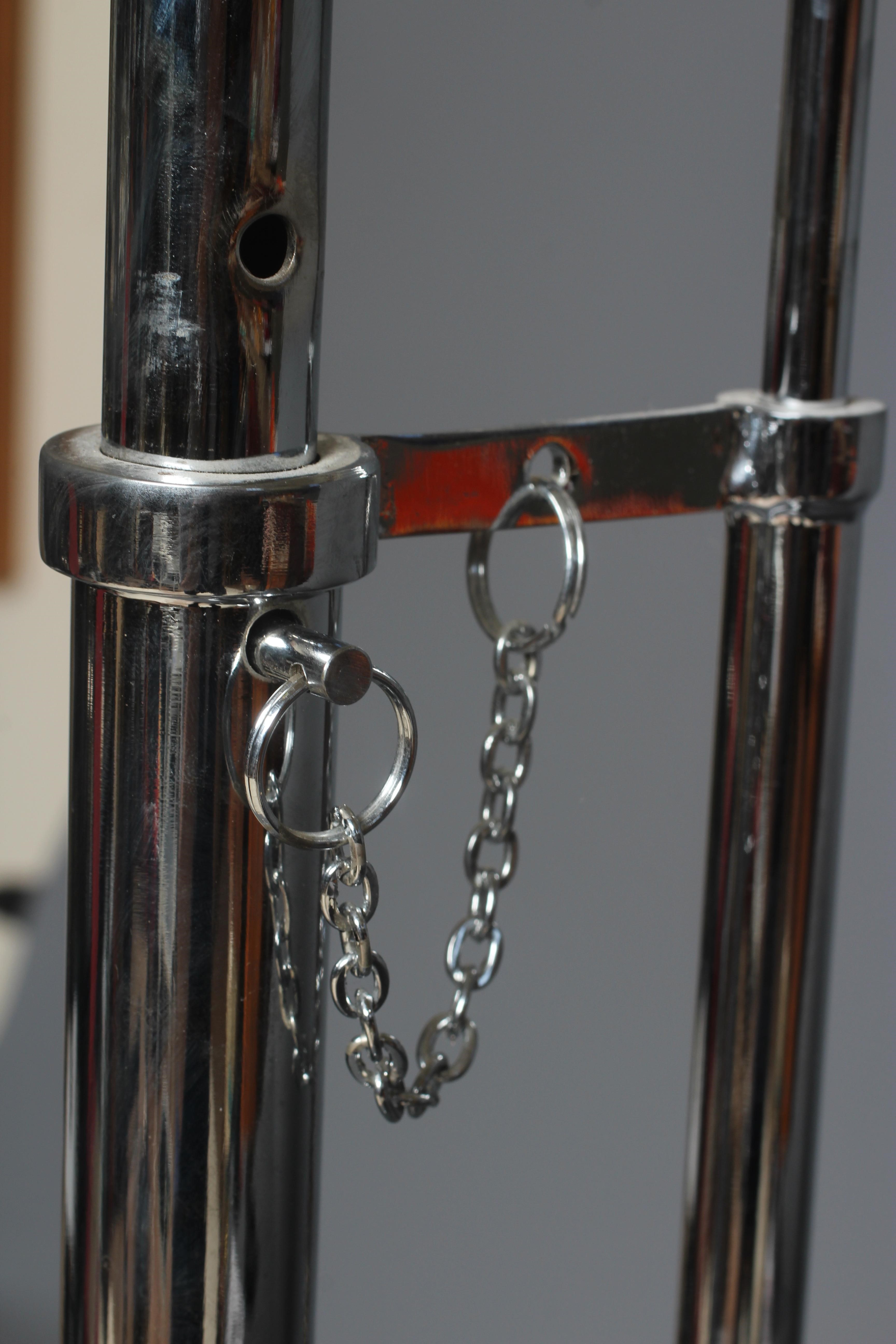 AFTER EILEEN GRAY - AN ADJUSTABLE E1027 SIDE TABLE, modern, the chromed steel frame supporting a Image