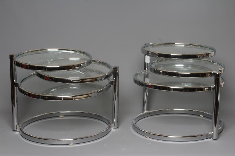 A PAIR OF LEITMOTIV DOUBLE SWIVEL SIDE TABLES, modern, the chromed steel frame supporting three Image