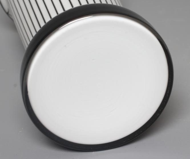 A JOSEF HOFFMANN WIENER WERKSTATTE STYLE WHITE FROSTED GLASS VASE of flared cylindrical form on a Image