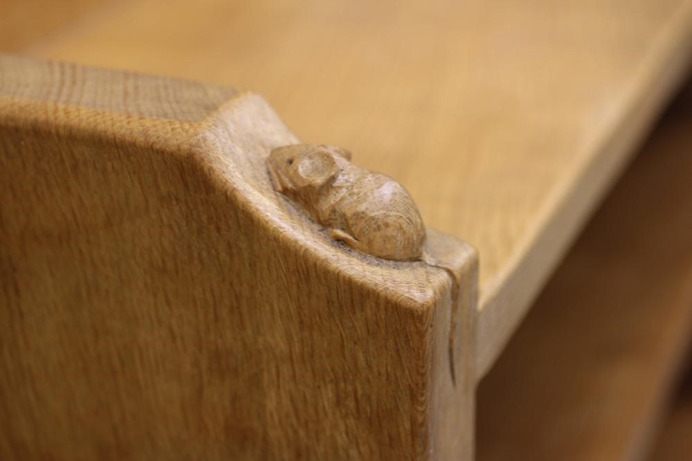 A ROBERT THOMPSON ADZED OAK OPEN BOOKCASE with galleried top and four adjustable shelves Image