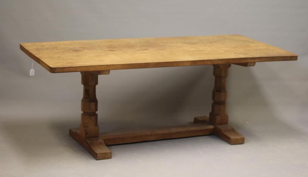 A ROBERT THOMPSON ADZED OAK DINING TABLE Image