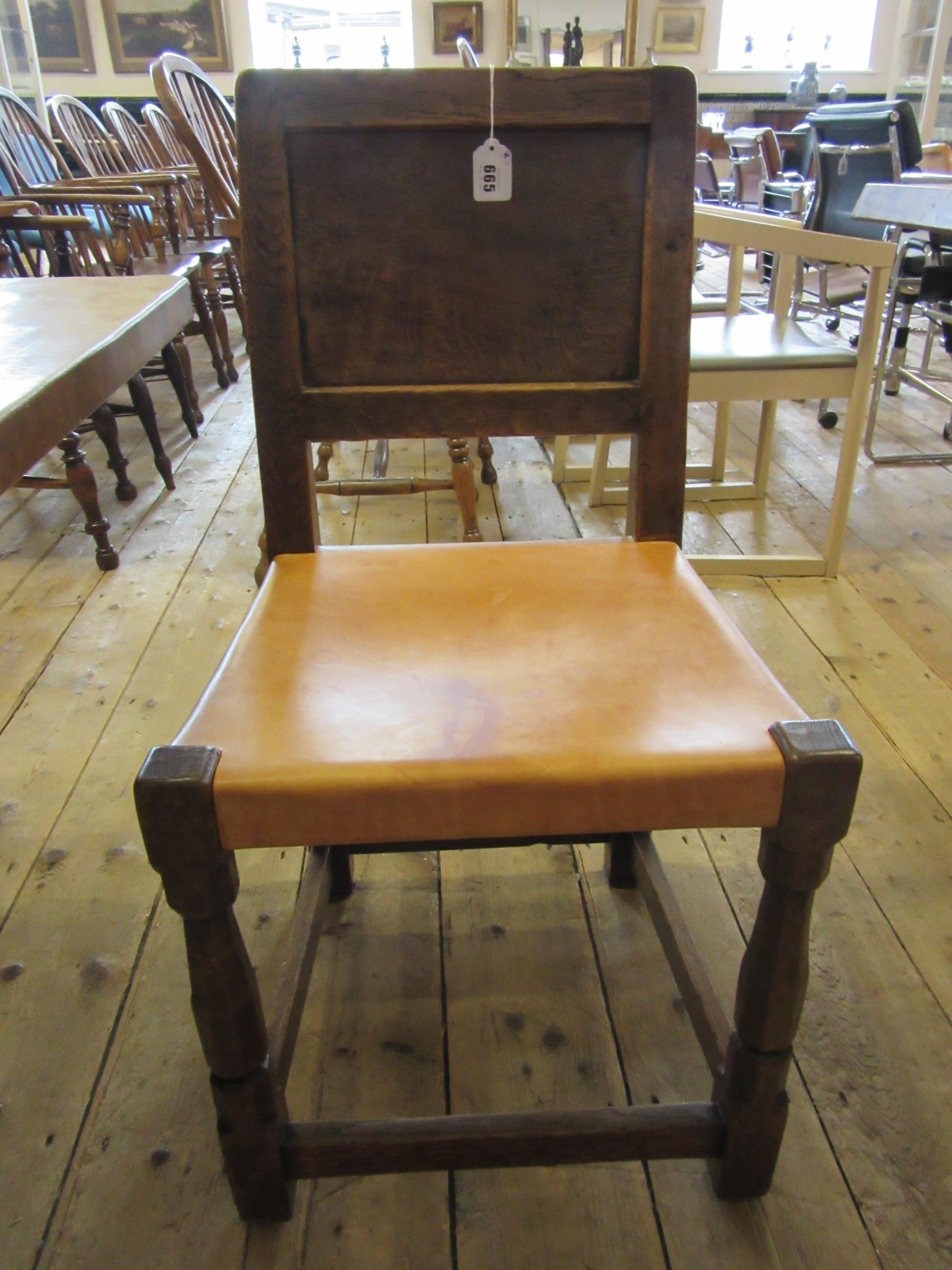 A ROBERT THOMPSON SET OF SEVEN ADZED OAK DINING CHAIRS Image