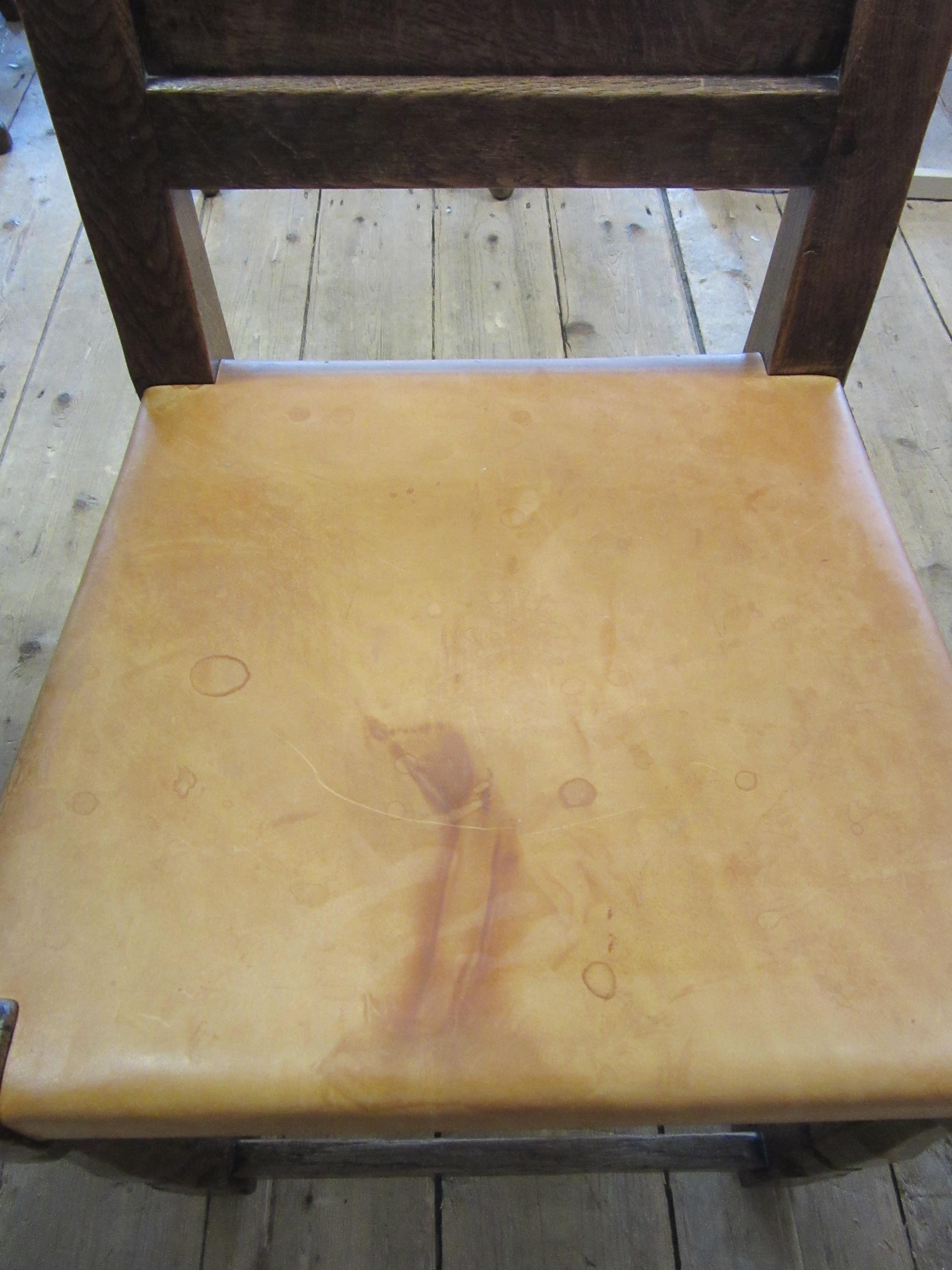 A ROBERT THOMPSON SET OF SEVEN ADZED OAK DINING CHAIRS Image