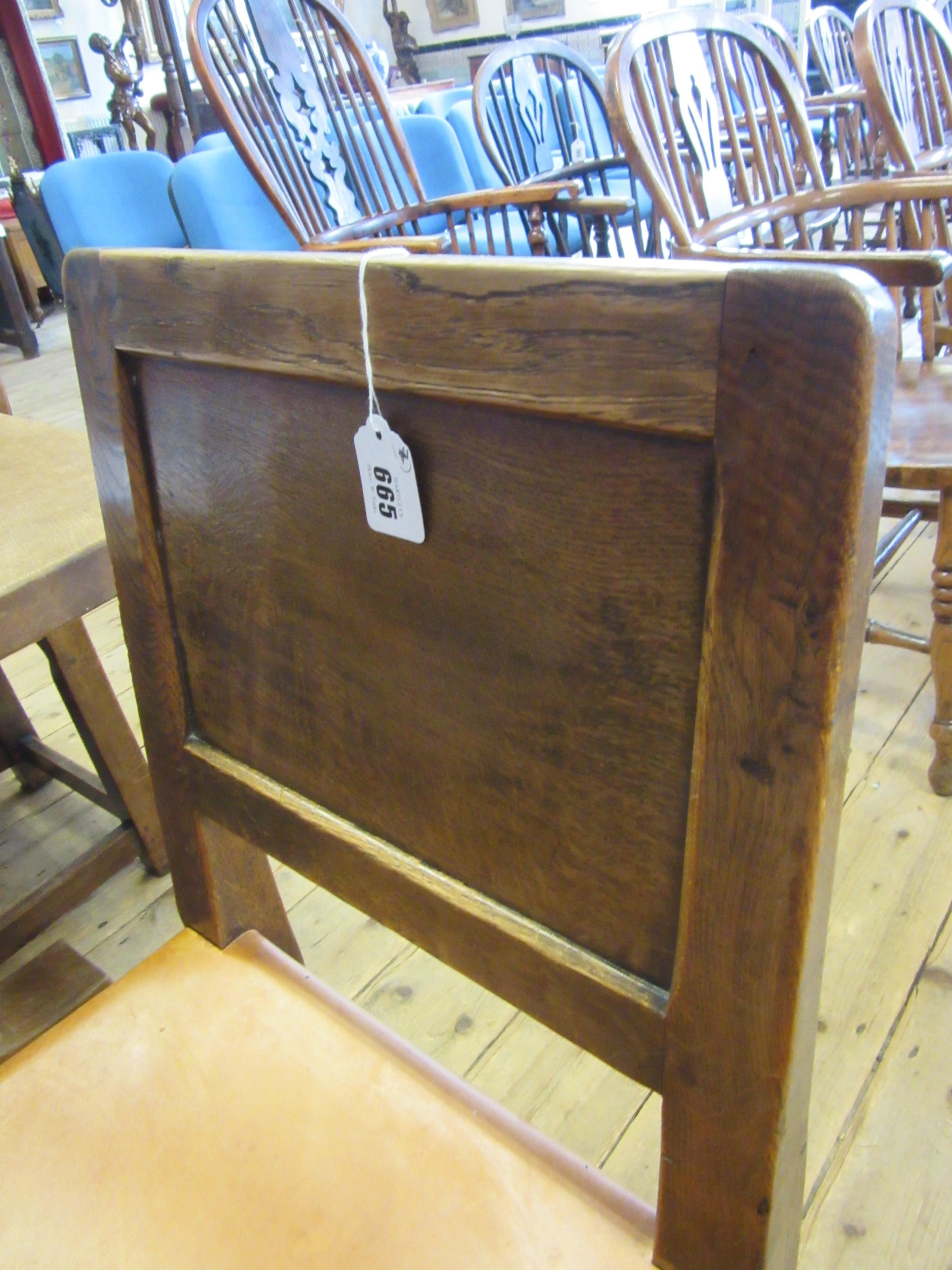 A ROBERT THOMPSON SET OF SEVEN ADZED OAK DINING CHAIRS Image
