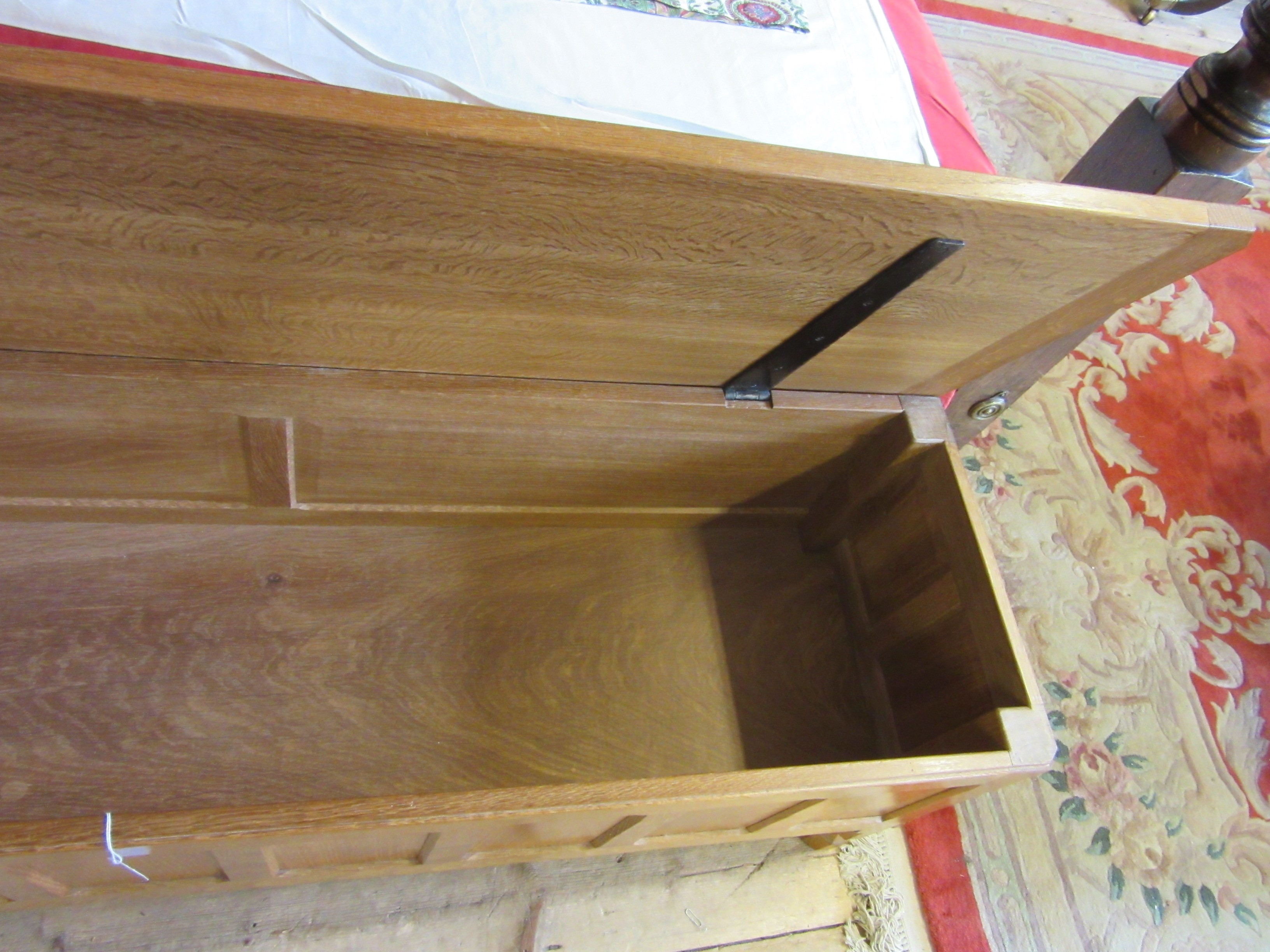 A ROBERT THOMPSON ADZED OAK PANELLED BLANKET CHEST of canted oblong form Image
