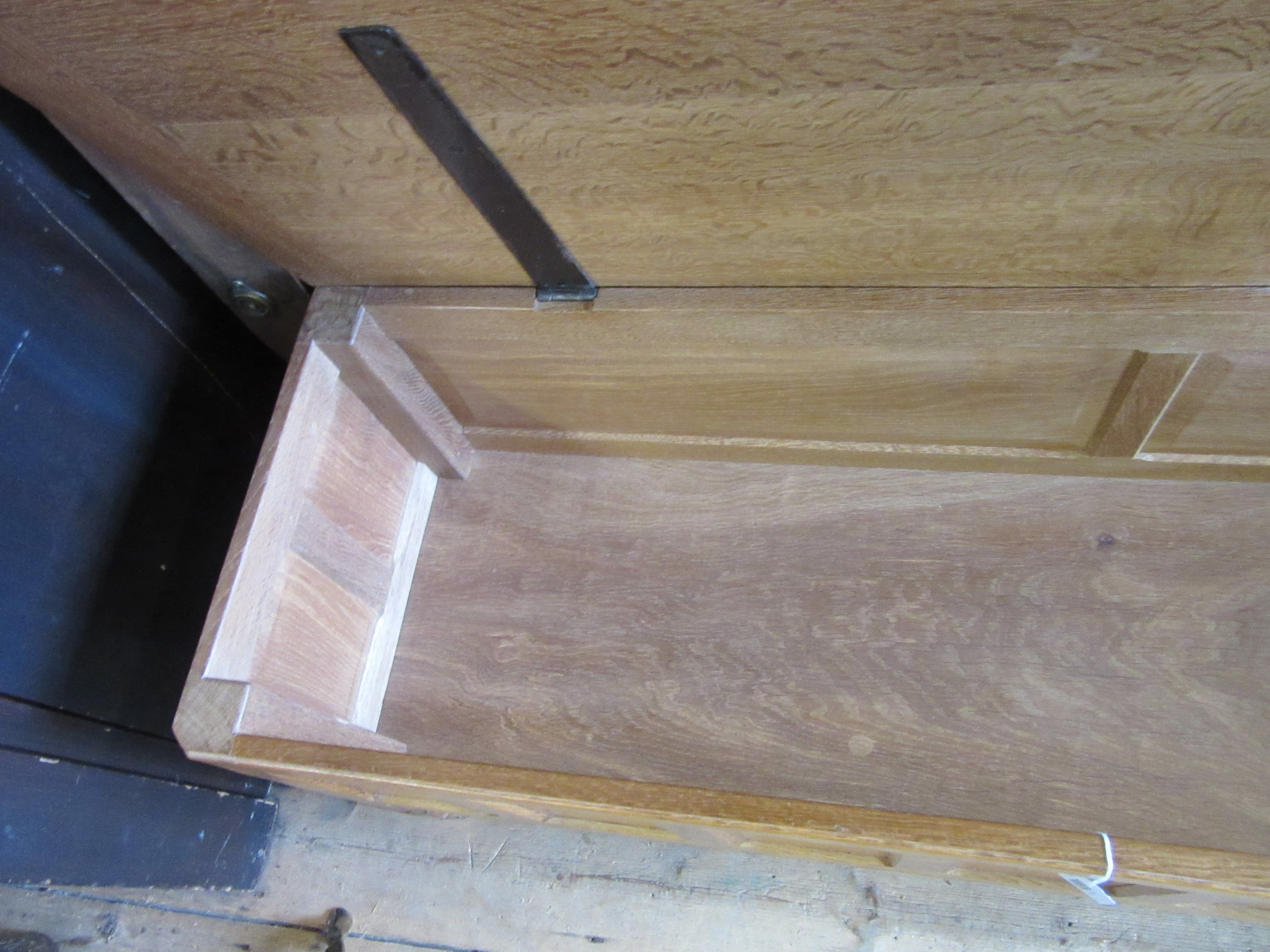A ROBERT THOMPSON ADZED OAK PANELLED BLANKET CHEST of canted oblong form Image