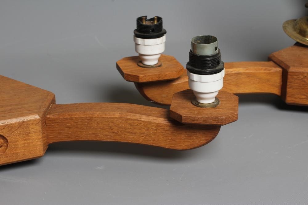 ACORN INDUSTRIES GEORGE GRAINGER - A PAIR OF OAK THREE LIGHT PENDANTS Image