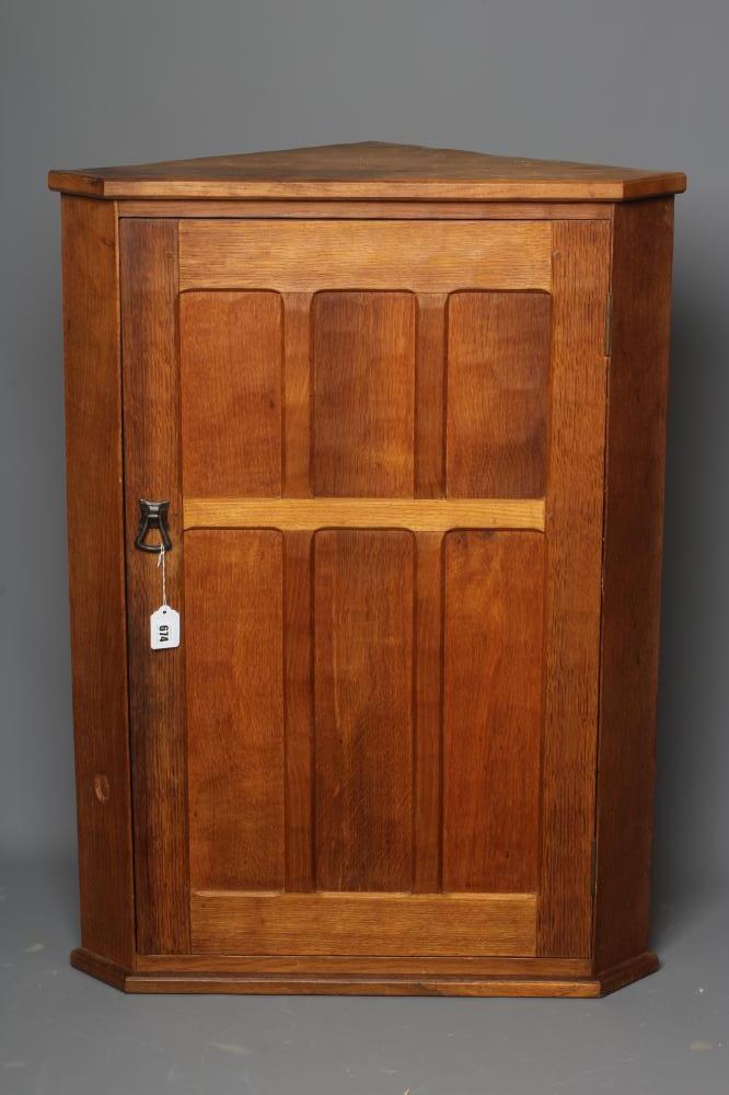 ACORN INDUSTRIES GEORGE GRAINGER - AN ADZED OAK CORNER CUPBOARD Image