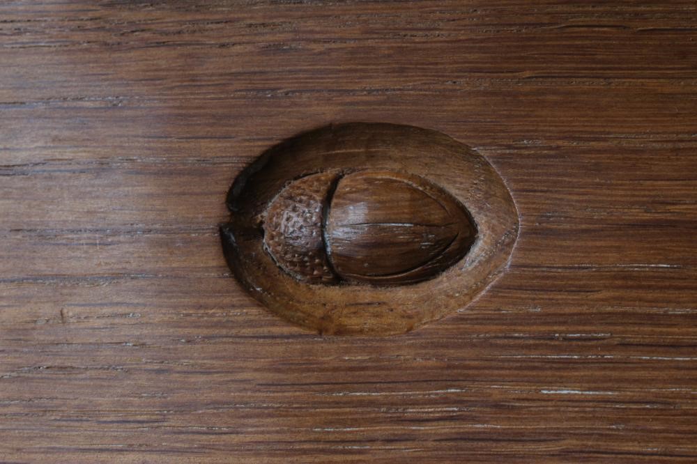 ACORN INDUSTRIES GEORGE GRAINGER - AN ADZED OAK CORNER CUPBOARD Image