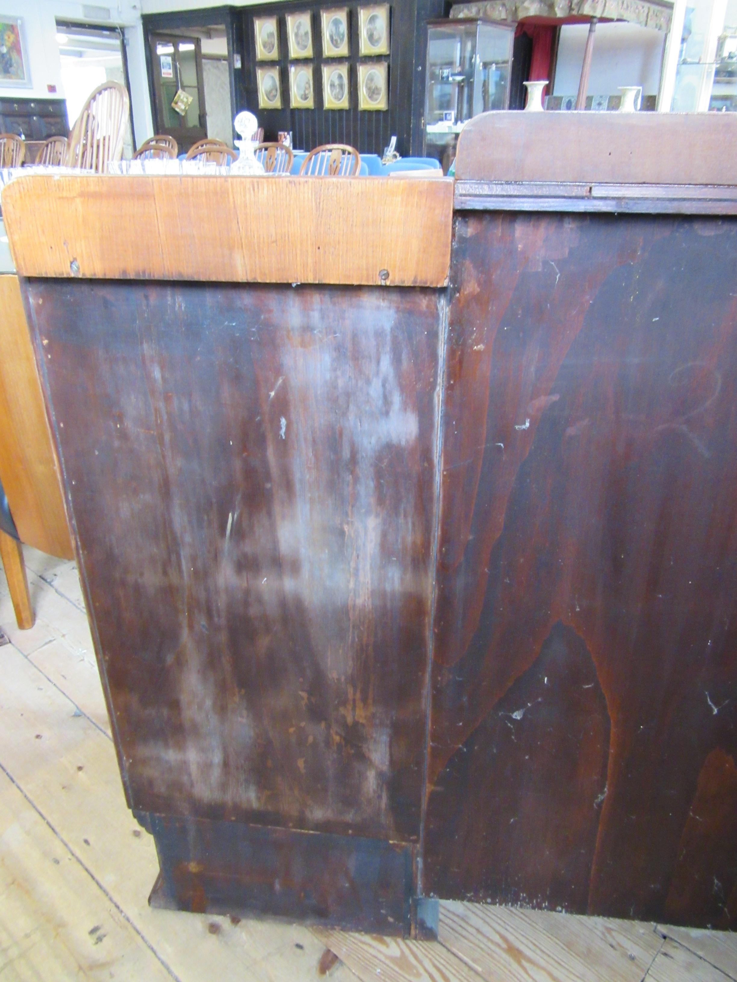AN ART DECO WALNUT DINING SUITE comprising a draw leaf table with well figured oblong top Image