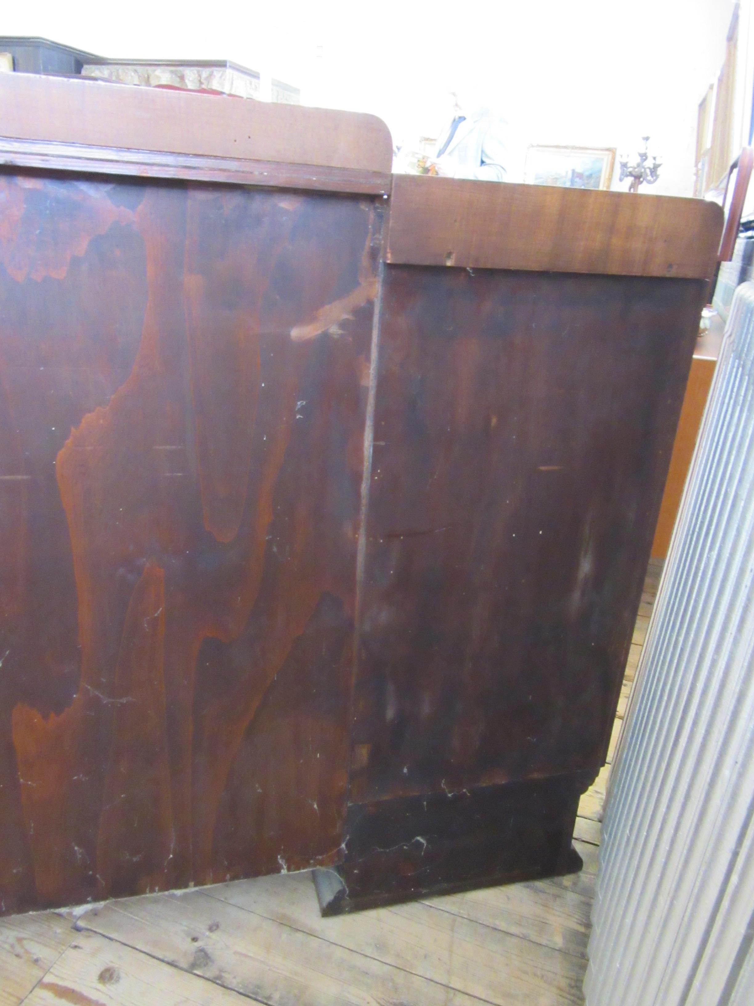 AN ART DECO WALNUT DINING SUITE comprising a draw leaf table with well figured oblong top Image