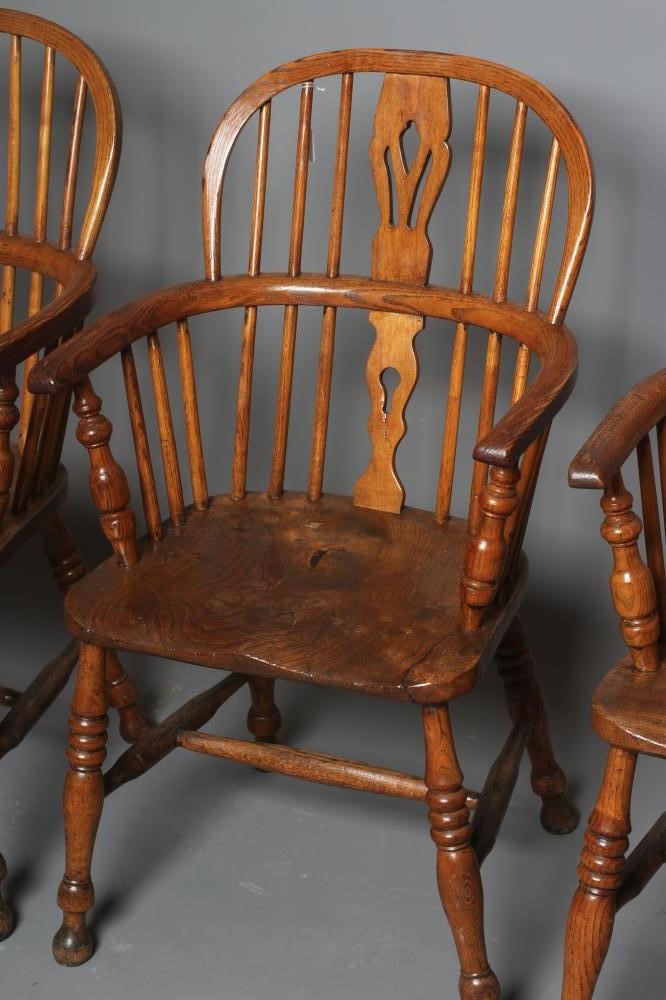 A SET OF TEN ASH AND ELM WINDSOR ARMCHAIRS Image
