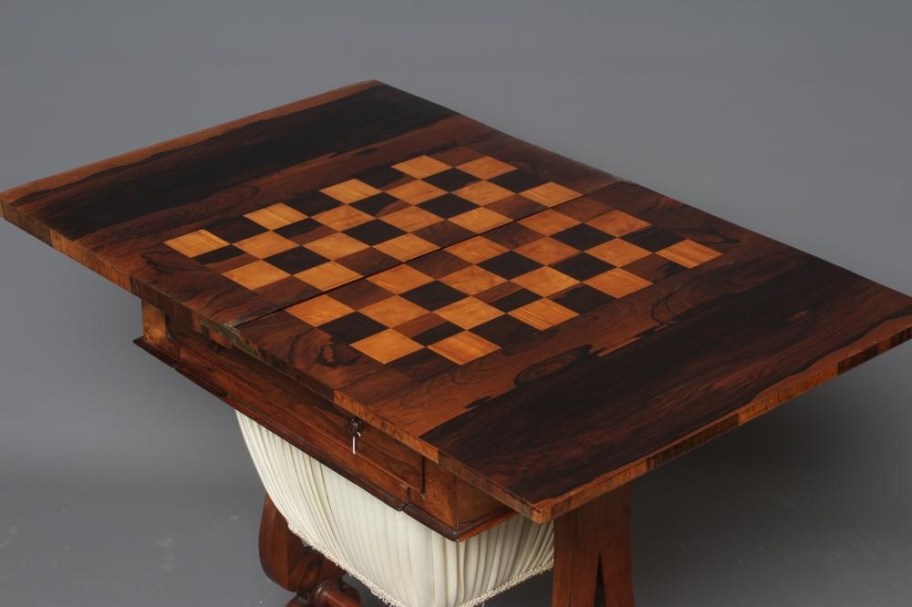 A VICTORIAN ROSEWOOD GAMES/WORKTABLE Image