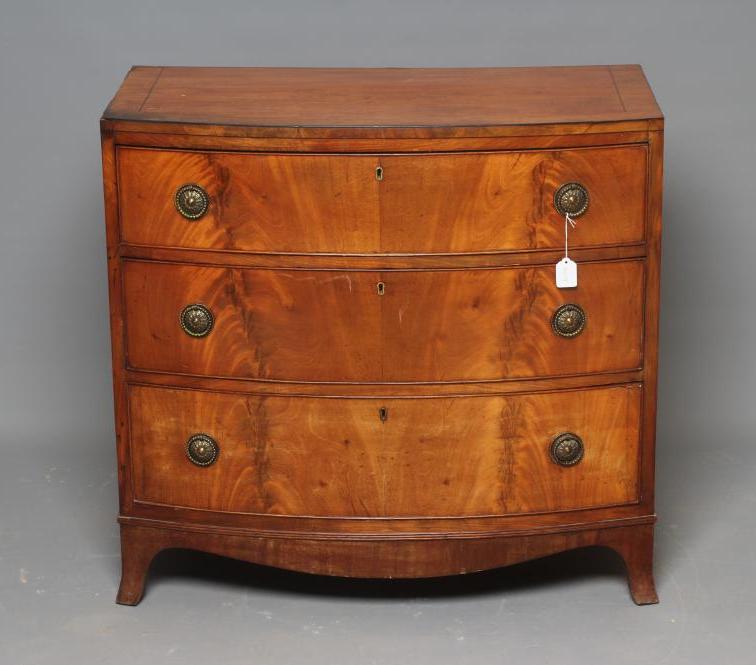 A SMALL REGENCY MAHOGANY BOWED CHEST Image
