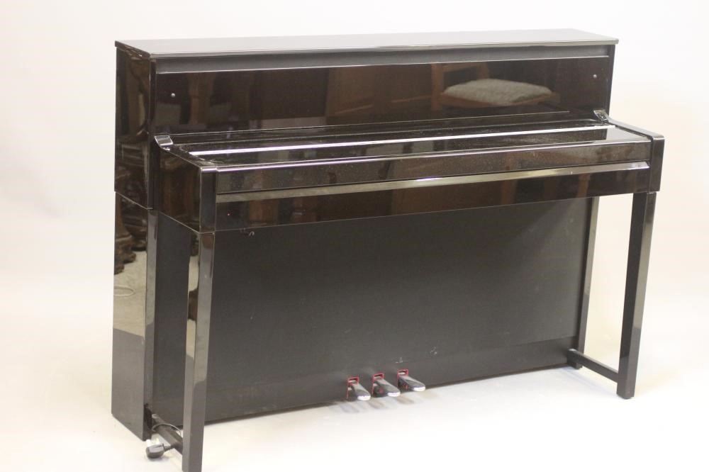 A YAMAHA "CLAVINOVA" ELECTRIC PIANO, modern, in upright ebonised case, 57 3/4" w x 18 3/4" d x 40" Image