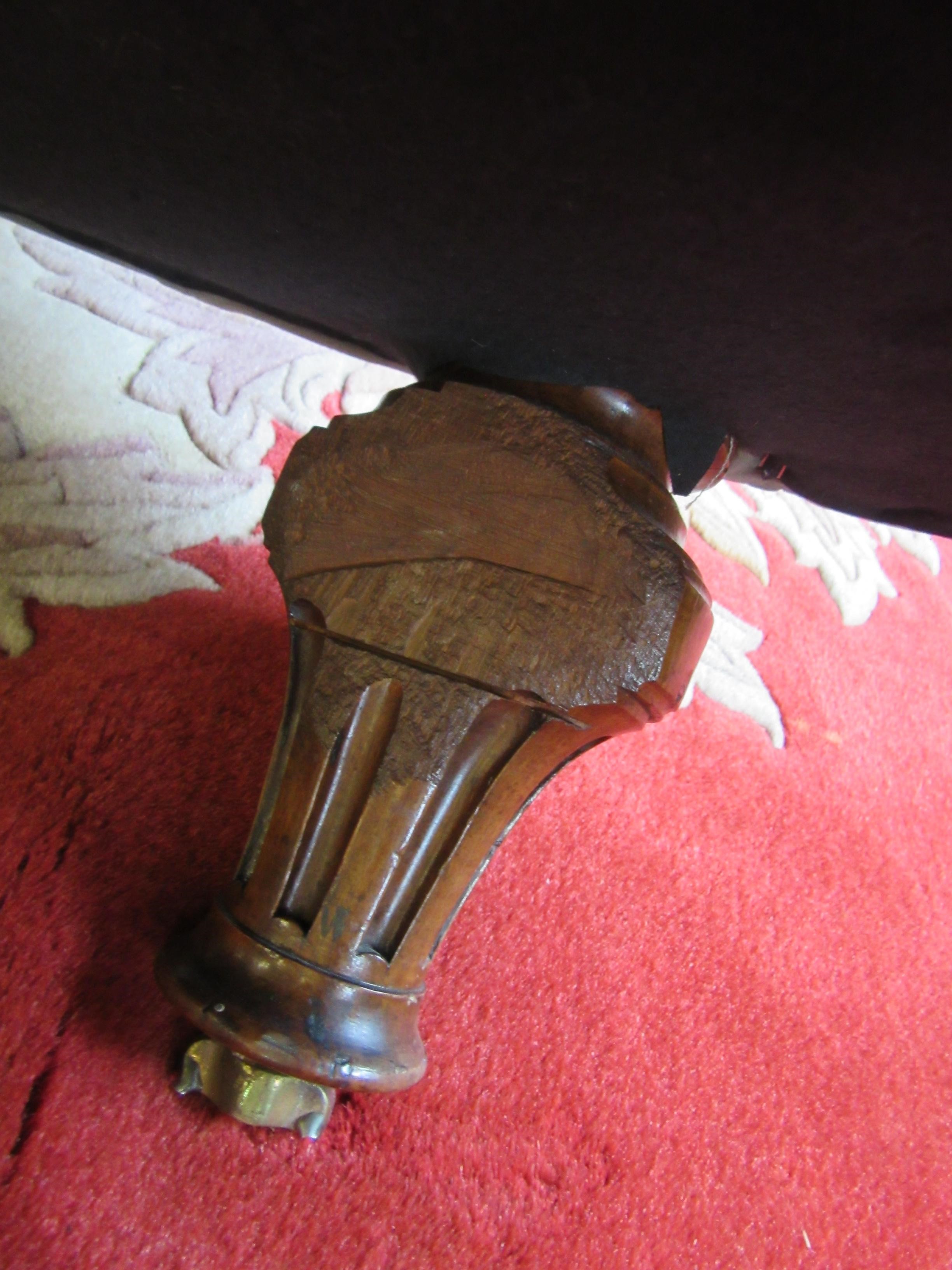 A VICTORIAN WALNUT FRAMED CHESTERFIELD SOFA of curved outline button upholstered in pale green Image
