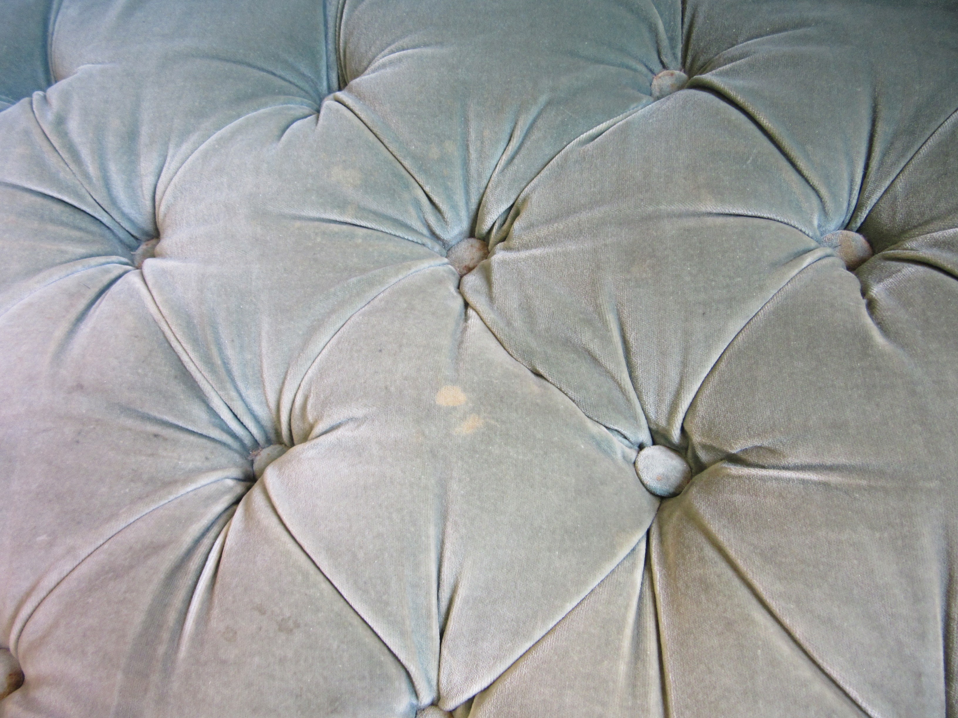 A VICTORIAN WALNUT FRAMED CHESTERFIELD SOFA of curved outline button upholstered in pale green Image