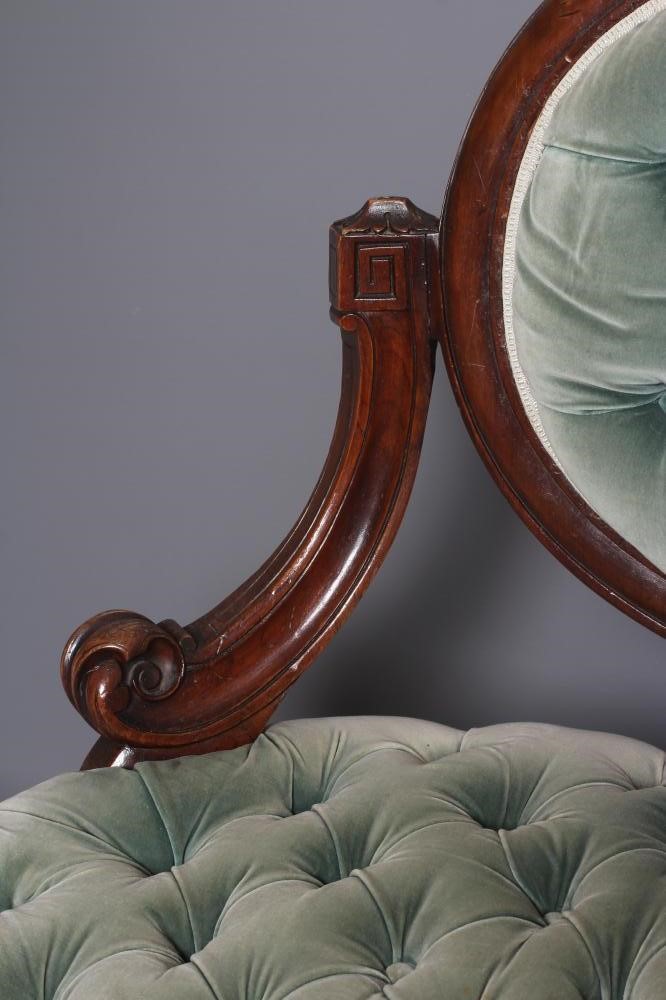 A VICTORIAN WALNUT SHOWFRAME SALON SOFA button upholstered in pale green dralon Image