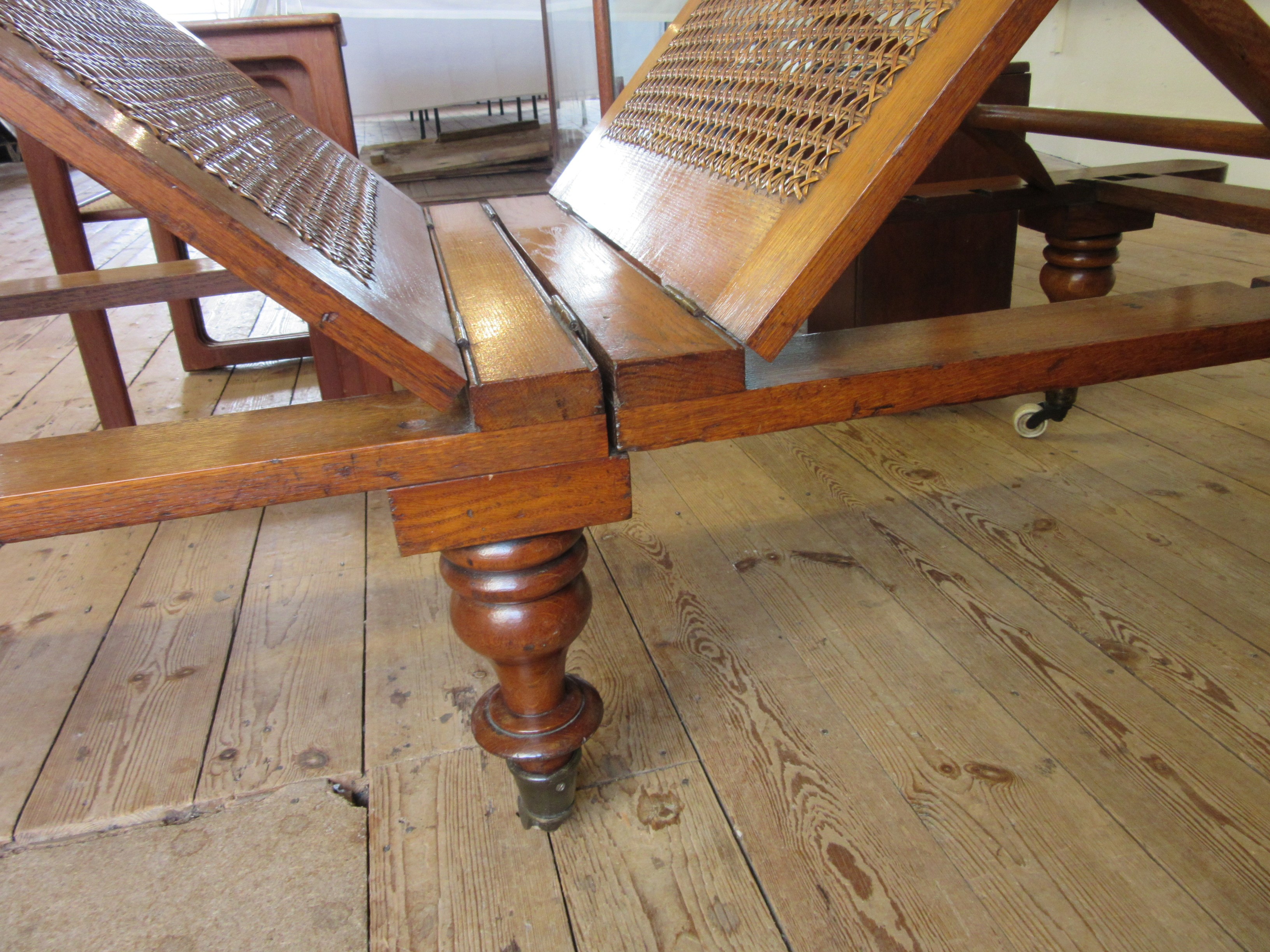 A VICTORIAN ROBINSONS OAK "ILKLEY COUCH" in the campaign style with adjustable caned panels Image