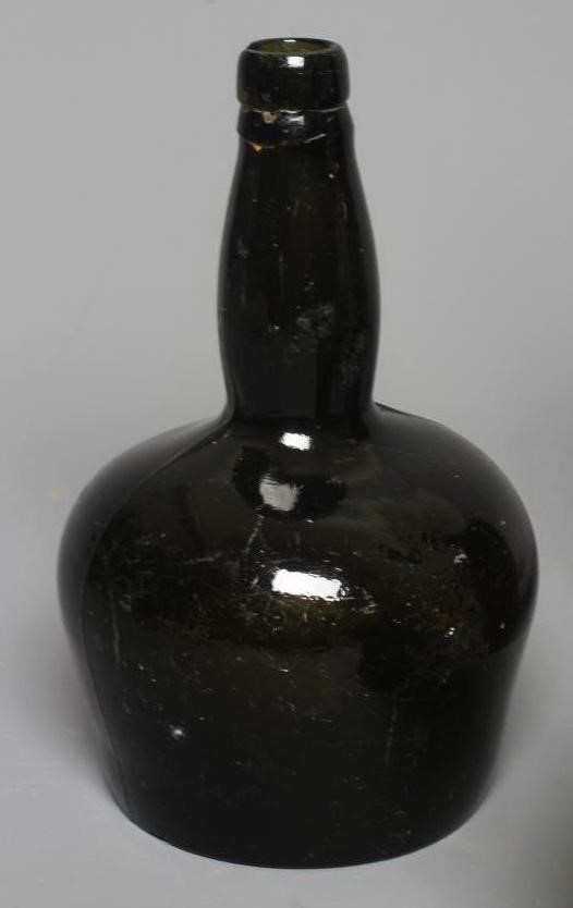 SEVEN GREEN GLASS BOTTLES including a wine bottle with a griffin seal Image