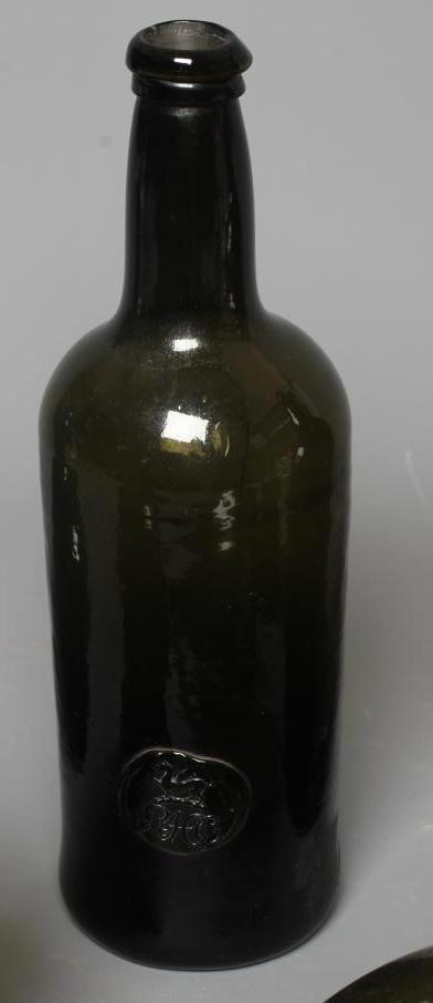 SEVEN GREEN GLASS BOTTLES including a wine bottle with a griffin seal Image