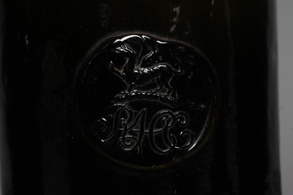 SEVEN GREEN GLASS BOTTLES including a wine bottle with a griffin seal Image