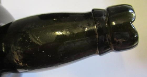 SEVEN GREEN GLASS BOTTLES including a wine bottle with a griffin seal Image