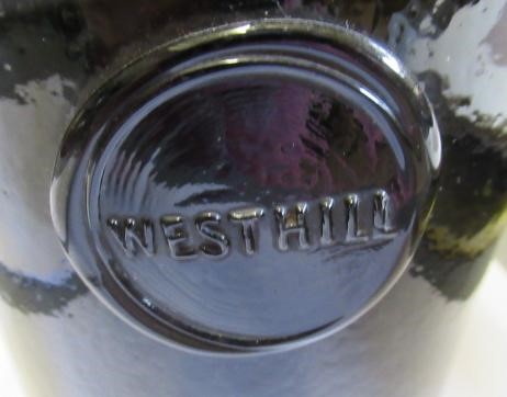 SEVEN GREEN GLASS BOTTLES including a wine bottle with a griffin seal Image