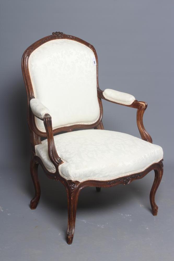 A STAINED BEECH ARMCHAIR Image