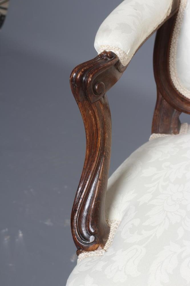 A STAINED BEECH ARMCHAIR Image