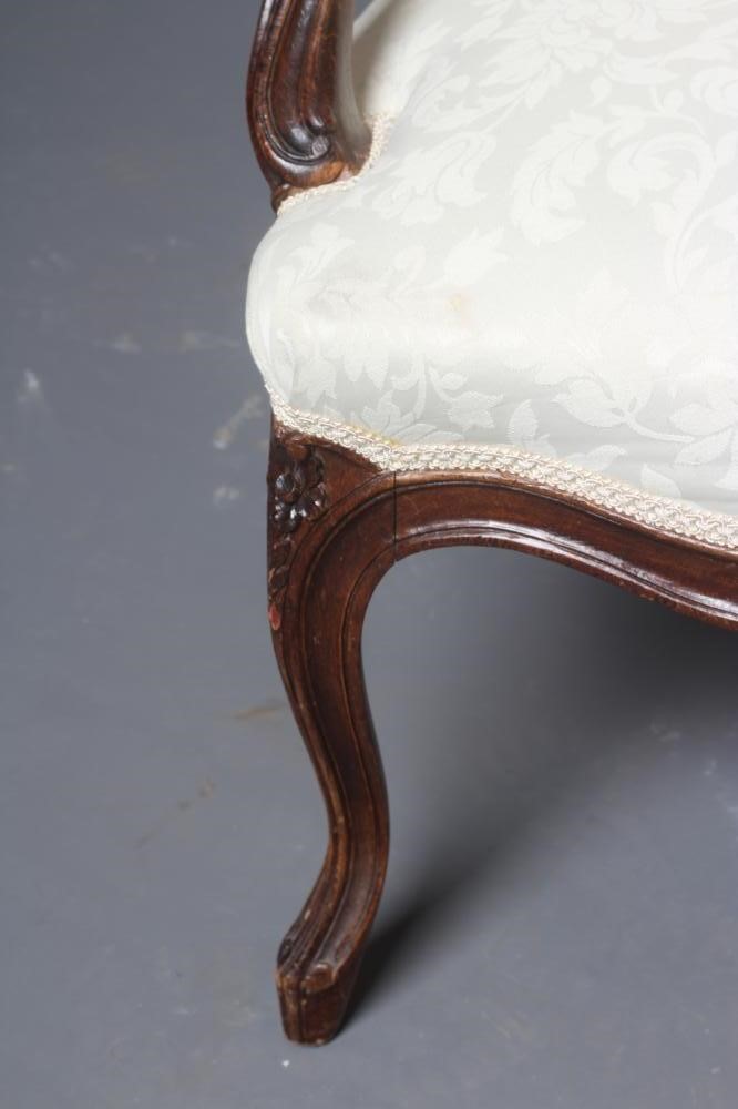A STAINED BEECH ARMCHAIR Image