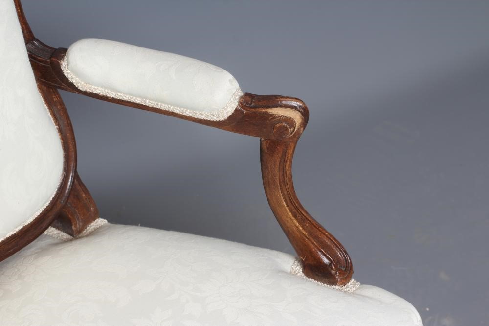 A STAINED BEECH ARMCHAIR Image