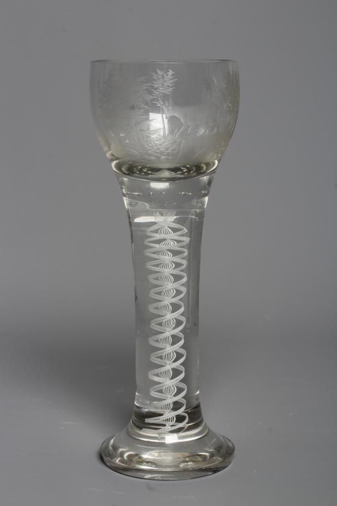 AN OUTSIZE CORDIAL GLASS, the rounded bowl engraved with a stag in a wooded glade, on an opaque Image