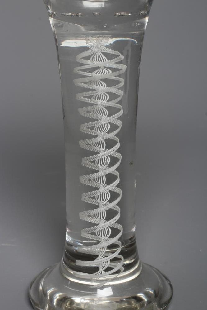 AN OUTSIZE CORDIAL GLASS, the rounded bowl engraved with a stag in a wooded glade, on an opaque Image