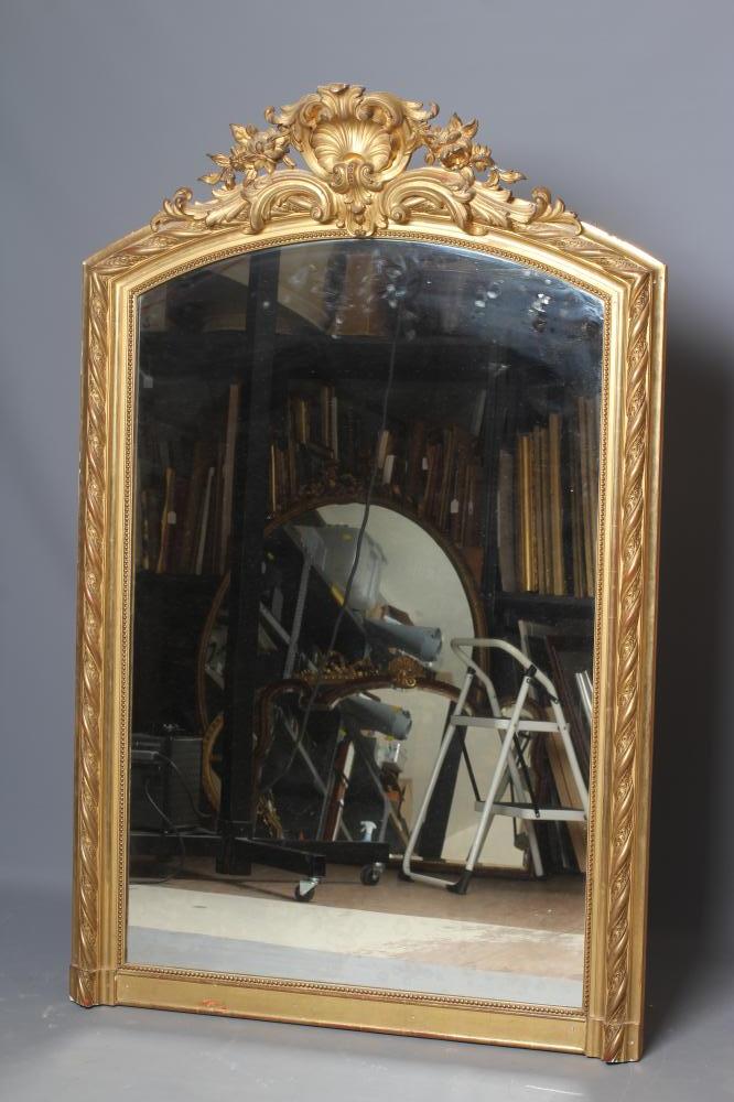 A CARVED GILTWOOD AND GESSO OVERMANTEL MIRROR Image