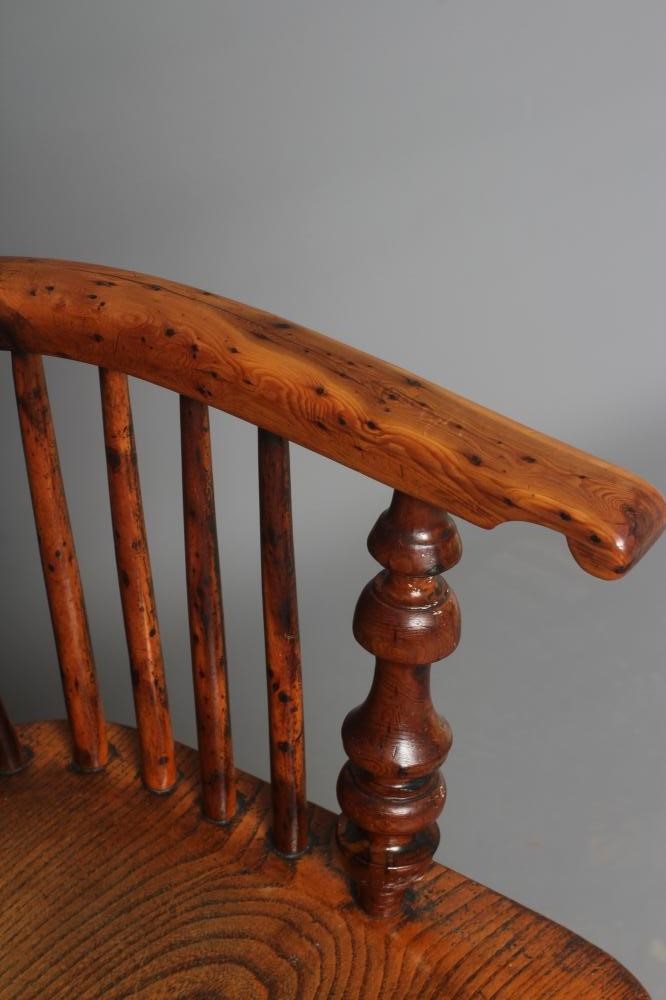 A YEW WOOD WINDSOR ARMCHAIR Image