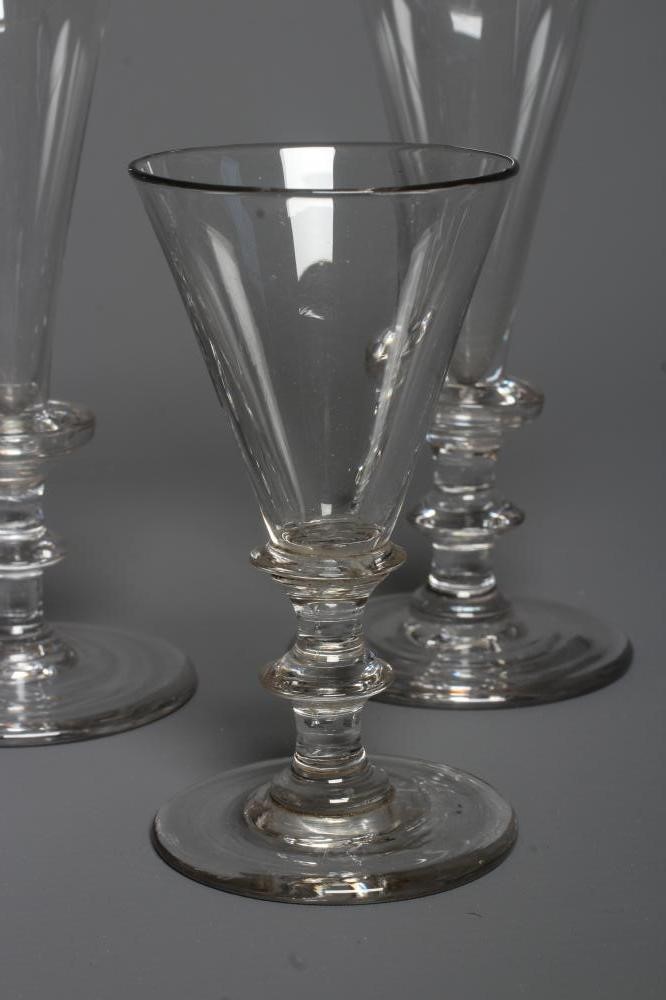 A SET OF SIX GLASS CHAMPAGNE FLUTES Image