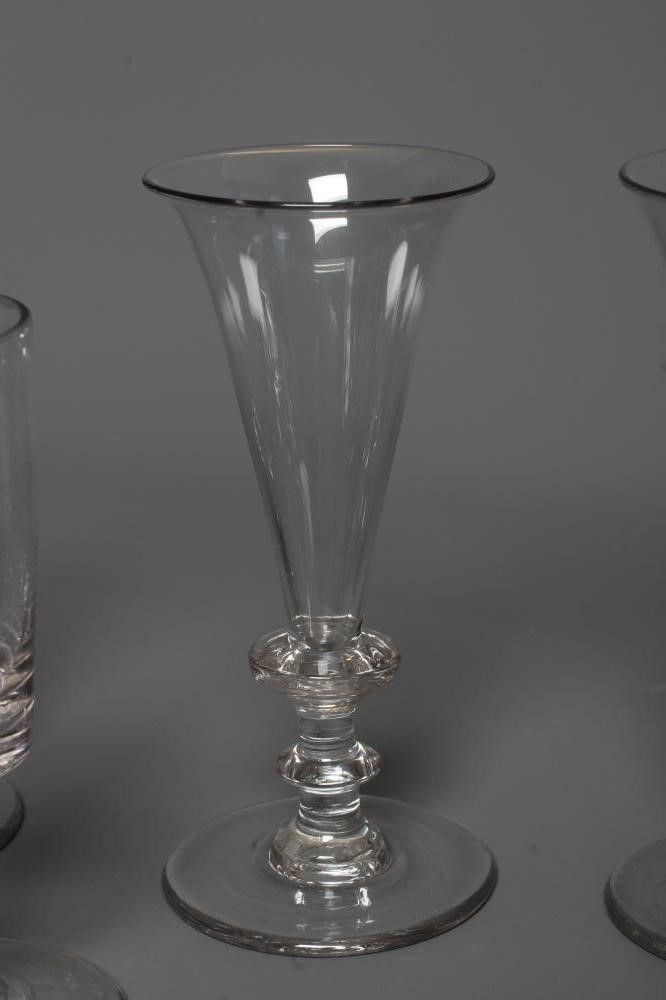 A SET OF SIX GLASS CHAMPAGNE FLUTES Image