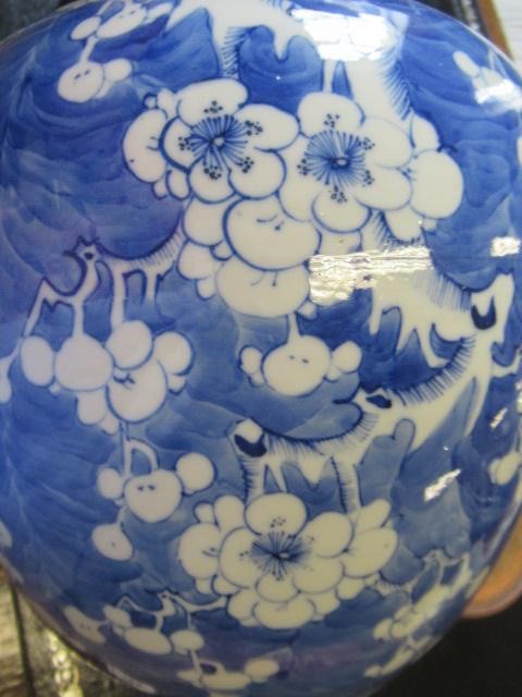 A CHINESE PORCELAIN LARGE JAR AND COVER painted in underglaze blue with cracked ice and prunus, six Image