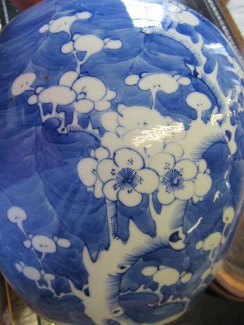 A CHINESE PORCELAIN LARGE JAR AND COVER painted in underglaze blue with cracked ice and prunus, six Image