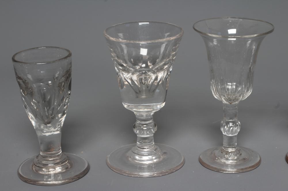 FIVE GEORGIAN CORDIAL GLASSES, five with panelled bowls, together with a Georgian dwarf candlestick Image