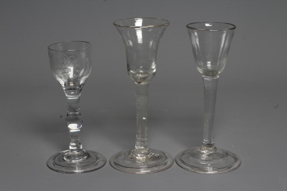 THREE GEORGIAN CORDIAL GLASSES comprising a round funnel bowl on plain cylindrical stem and folded Image